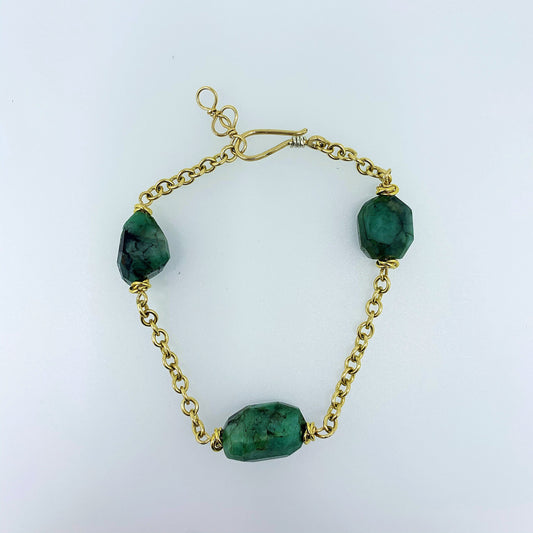 14k gold filled chained bracelet  with three beautiful natural emerald nuggets made adjustable with a hooked clasp.